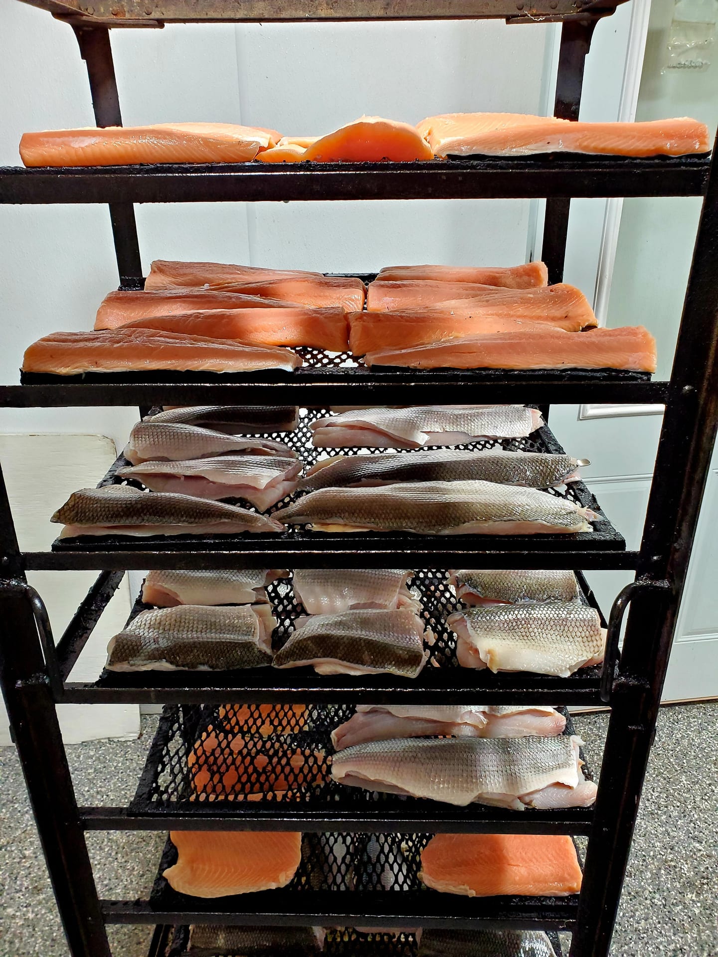 Fresh fish on rack in the smoker